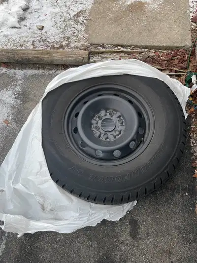 All 4 tires on rims for $200 Set of 4 winter tires on steel rims: LT265/70R17 Lightly used for 2 win...