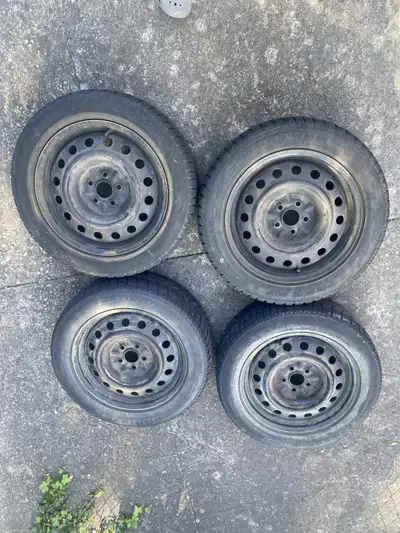 Set of 4 16 inch winter tires mounted on steel rims. Used, with visible tread remaining and typical...