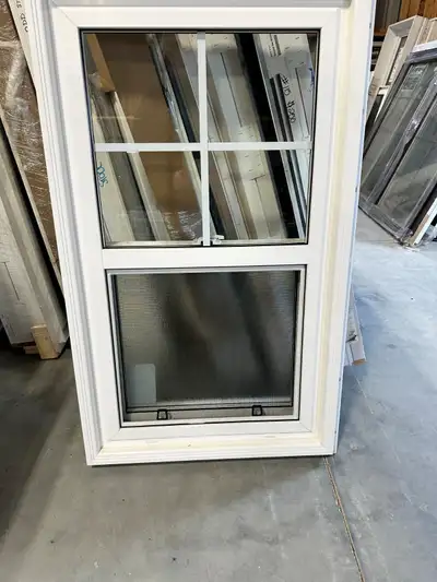 Single hung window with privacy glass in bottom and 2x2 grill bottom in top. 22 7/8" x 39 5/8" 1 1/4...