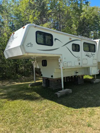 2002 Bigfoot Camper Base is 11.5ft with queen bed up top. Slide out dinette that converts to bed. Dr...