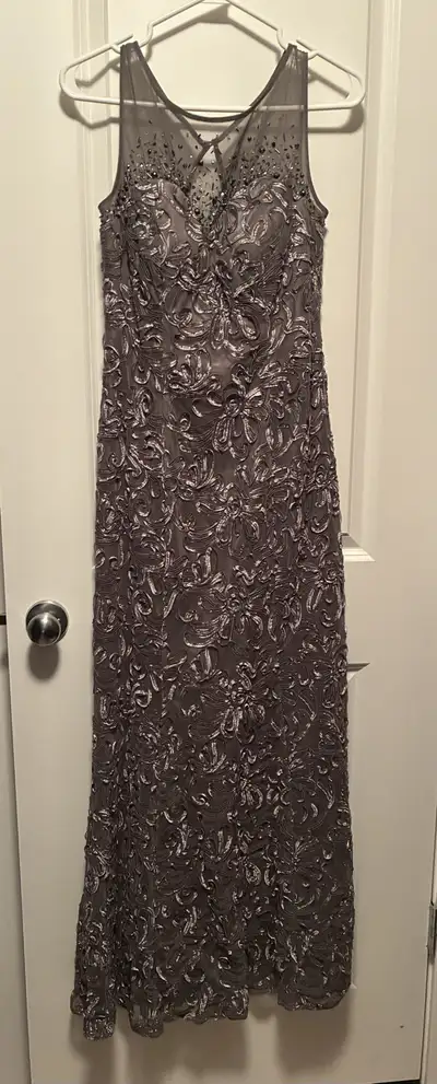 Lighter in daylight but shimmery in the evening. Worn once to wedding no issues. FCFS. Cash only.