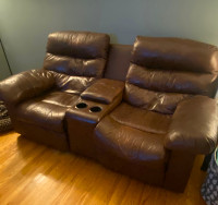 Leather loveseat recliner with centre console.
