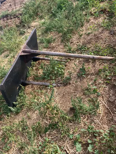 Fits any skid steer or bobcat. Moved thousands of bales it works great.