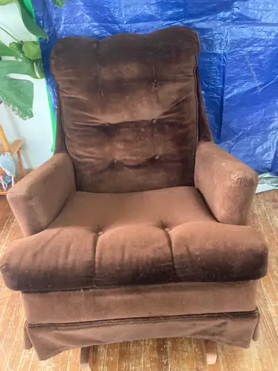 Free rocking chair. It’s a comfy chair but sits pretty low so it’s hard to get out of if you have ba...