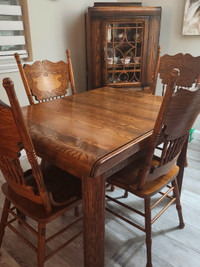 Antique Dining Room set with 4 chairs and china cabinet.