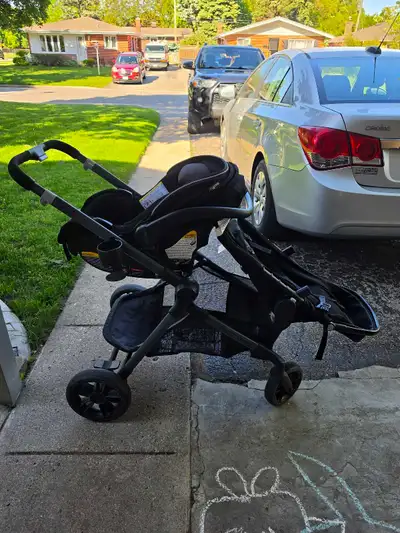 Evenflo Pivot double stroller with carseat and car base. Used lightly while shopping and neighborhoo...