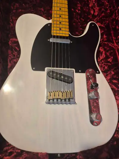These are a mix of old and modern features...quartersawn neck , compound radius , stainless frets ,...