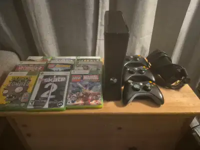 Xbox 360 slim with remotes and games for sale!!, View more