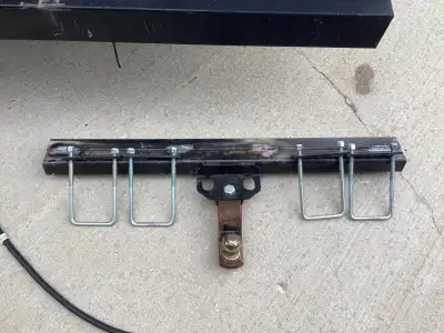 Trailer hitch that could be fastened to 4 in. by 4 in. bumper. Was on camper trailer.