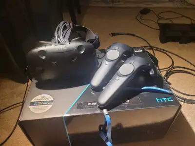 Htc vive in original box was barley used, headset, controllers, base stations, ect. Base stations NE...