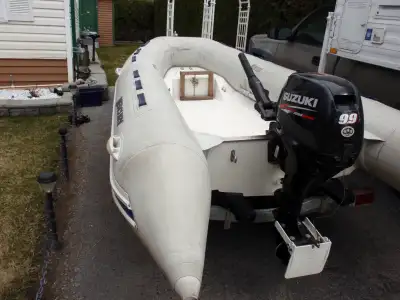 The Rigid Hull 350 Ocean Runner boat has a fiberglass v-hull and a flat inside deck. The hull has be...