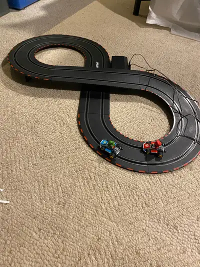 Carrea GO! Mario Kart battery operated slot car racing toy track set. Includes Mario and Luigi cars,...