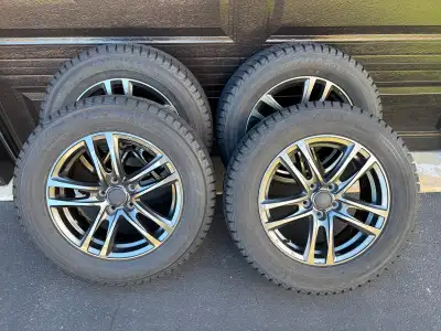 4 winter tires on stylish alloy rims. Yokohama Ice Guard. Lots of tread left. 225/65 R17 — used on N...