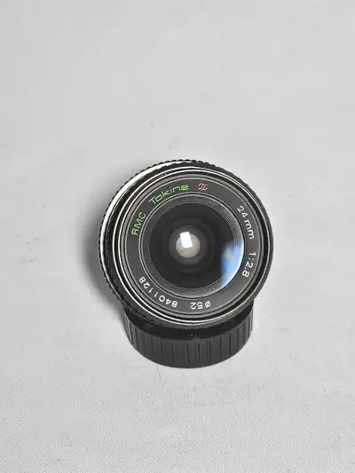 Tokina RMC 24mm f2.8 Manual Focus wide angle lense for Minolta. Optics clean and clear, focus smooth...