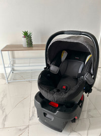 Baby Britax car seat with base included.