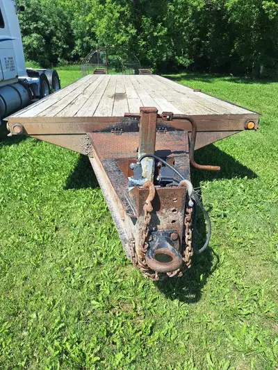 2006 Belshe 30' equipment trailer. 24' of usable deck plus 6' beaver tail 22,000 lbs gvwr Electric b...