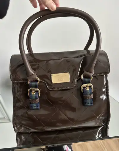 Brown TOMMY HILFIGER Handbag . Brand new. NEVER USED! Still has stuffing inside. Smoke free home. As...