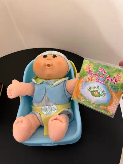 Good condition on this 2006 Cabbage Patch newborn boy doll. Includes carrier and never opened baby b...