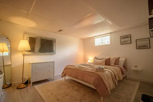 A private furnished basement room is available immediately in a quiet, clean, women-only shared suit...