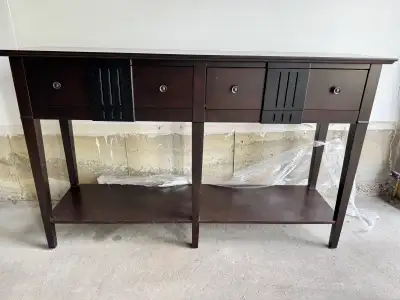 Purchased from Pier 1, this elegant dark wood console table is in good condition, offering both styl...