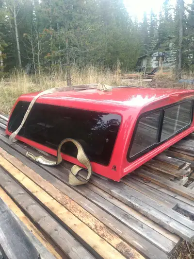 leer truck topper, in used condition small amount of damage scratches and chips. carpeted inside.Off...