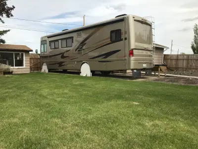Year: 2008 Holiday Rambler Triton 10 cyl. gas, 6 speed automatic. 2 Air conditioners with central ai...