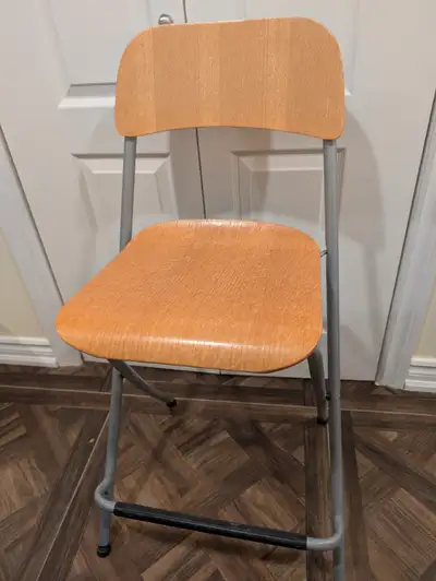 Two counter height foldable chairs from Ikea in excellent condition. Simple to fold up, easy to stow...