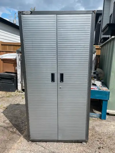 Metal shelving unit 6' x 3' x 1 1/2' for sale. Great for garage storage. Asking $20.00