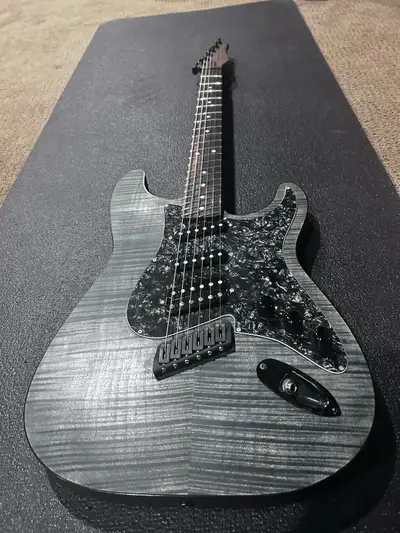 Canadian made. Multiscale frets. H-S-S pick up config plus a piezo. Guitar looks brand new. Have $25...