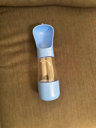 Dog Water Bottle. Has food container at bottom. Pick up only, No holds. $15. Price is not negotiable...