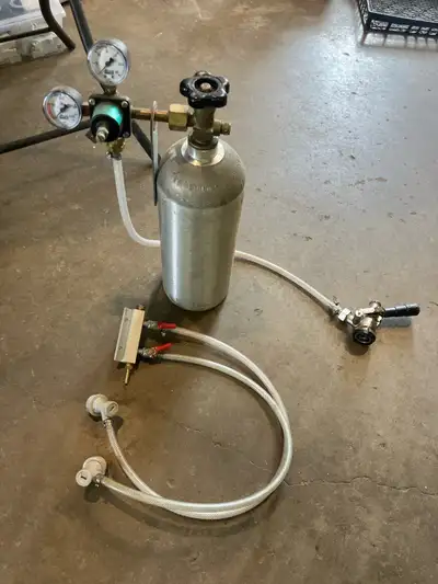 C02 tank, gauge, manifold for 2 keg setup, and a other tap for kegs asking 120$ 709-764-8418