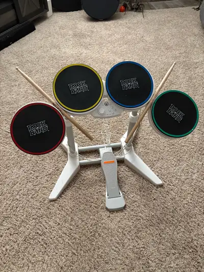 Foot pedal and set of drum sticks included.