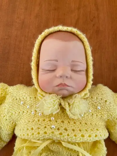 This lovely vintage doll has a soft body and is approximately 20" long. Comes complete with Yellow K...