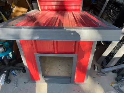 Just built red siding and roof metal dog house 36 D x 34 W x 39 H at its most highest point. Has a r...