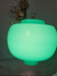 Vintage lighting fixture with a soft green light.
