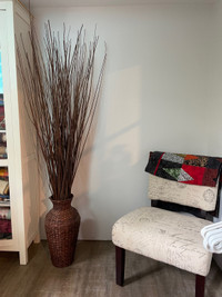 Decorative twigs in a wicker vase 