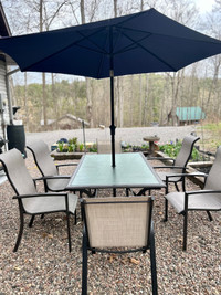 Steel & Glass Patio table set (6 chairs) Like new 