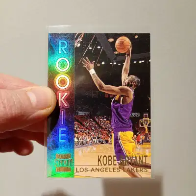 Own a piece of basketball history with this 1996-97 Topps Stadium Club Kobe Bryant Rookie Card! This...