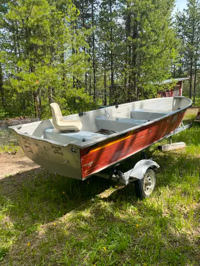 14’ Harbour craft aluminum boat includes trailer and oars.
