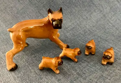 Vintage Napco Ceramic Japan Boxer Dog Figurine with 4 Pups. The back leg of the large boxer dog has...