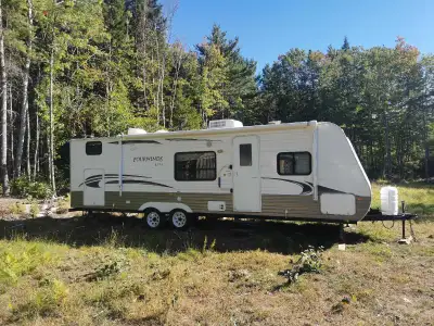2011 29' Fourwinds Lite travel trailer. Inside, you'll find a cozy interior with all the essentials...