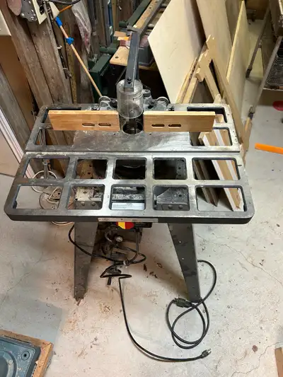1/2 inch wood shaper complete with $75.00 of cutters in good working condition