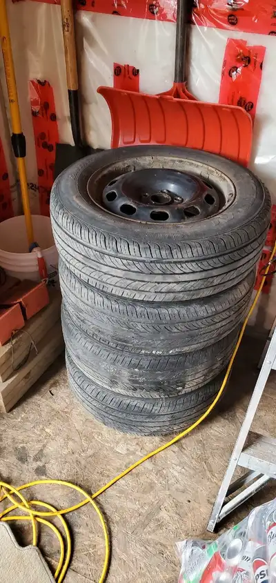 I have four great all season tires on rims with 3 15 inch hubcaps off a 2009 Toyota corolla. Tires a...