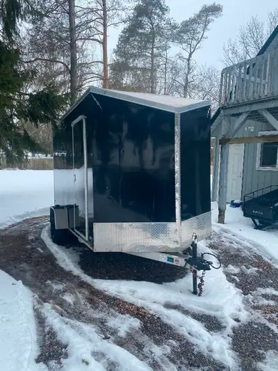 7x12 v nose .with brakes. .very little use. Mainly storage. 74 inches wide by 83 inch high door open...