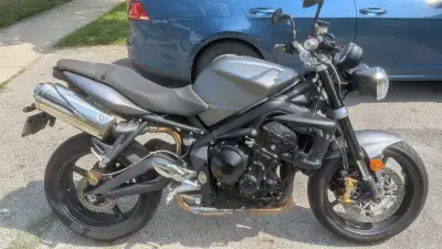 Of the 12 bikes I've owned....this one was my favourite. The 2009 Street Triple is the OG of smaller...