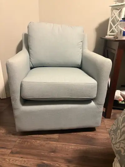 Light blue deep padded swivel accent chair. Great condition.