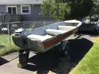 14 ft. aluminum boat, EZ Loader 2 hp, 4 stroke Honda outboard