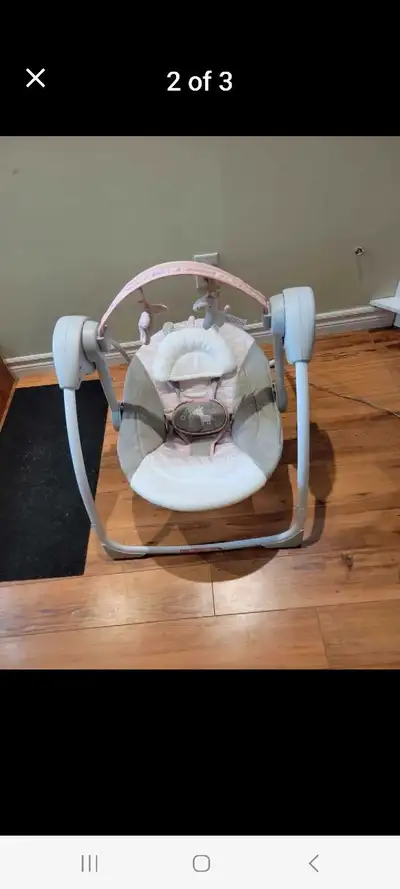 Ingenuity baby swing ,5 different speeds plays music , brand new condition, hanging toy bar to enter...