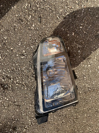 Honda Ridgline passenger headlight cover