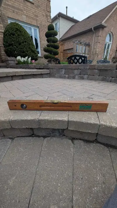 Antique wooden level. Made in England by Elliott Lucas Ltd. Shows some wear consistent with age and...